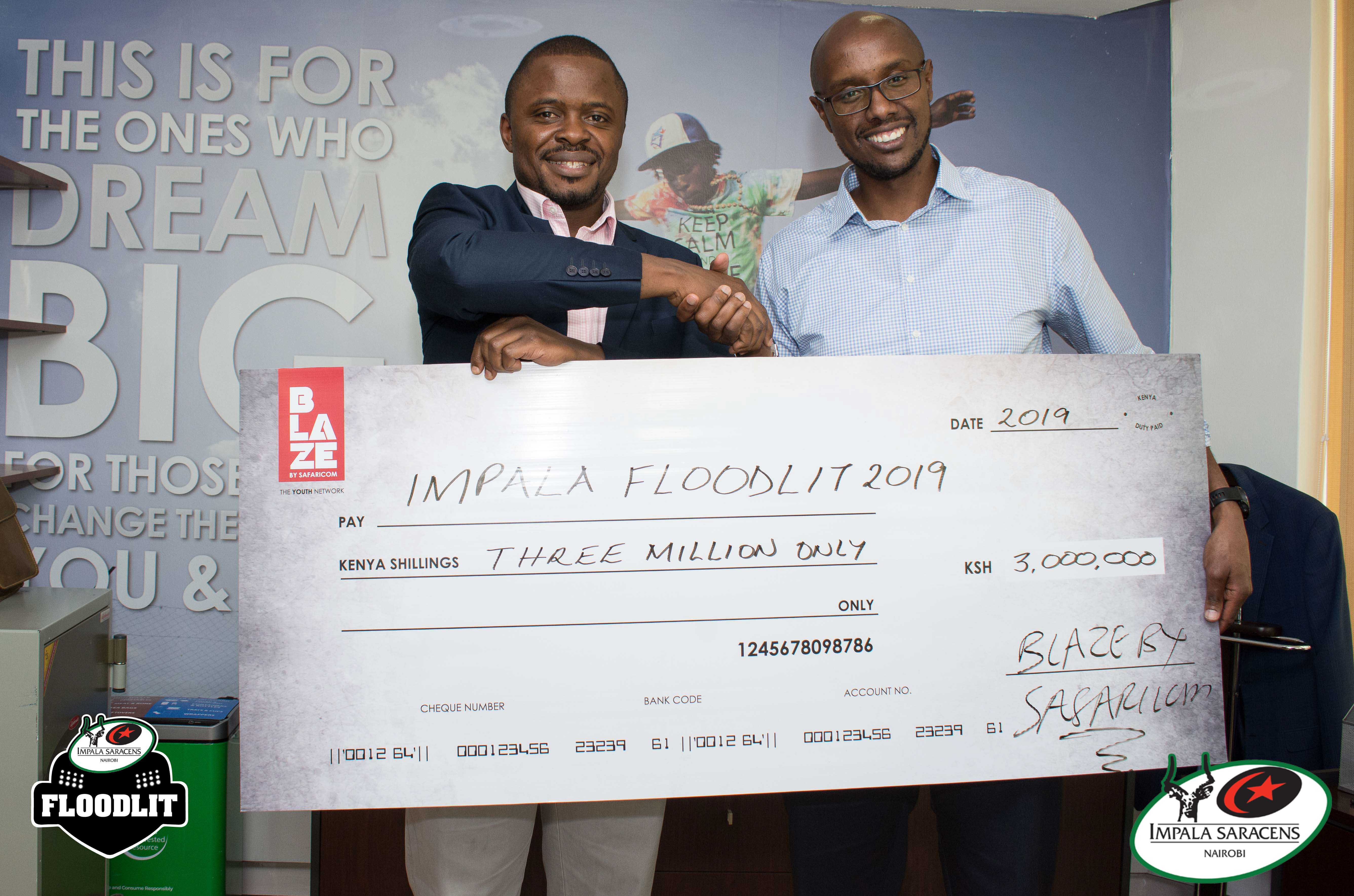 Bob Asiyo Resolution Impala Rugby Chairman and Charles Kare Wanjohi Safaricom's Consumer Business  Unit director  during the cheque handover ceremony of Impala floodlit Tournamnet.