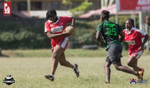 Resolution Impala Saracens Ladies head coach, Mary Atieno evading a tackle.