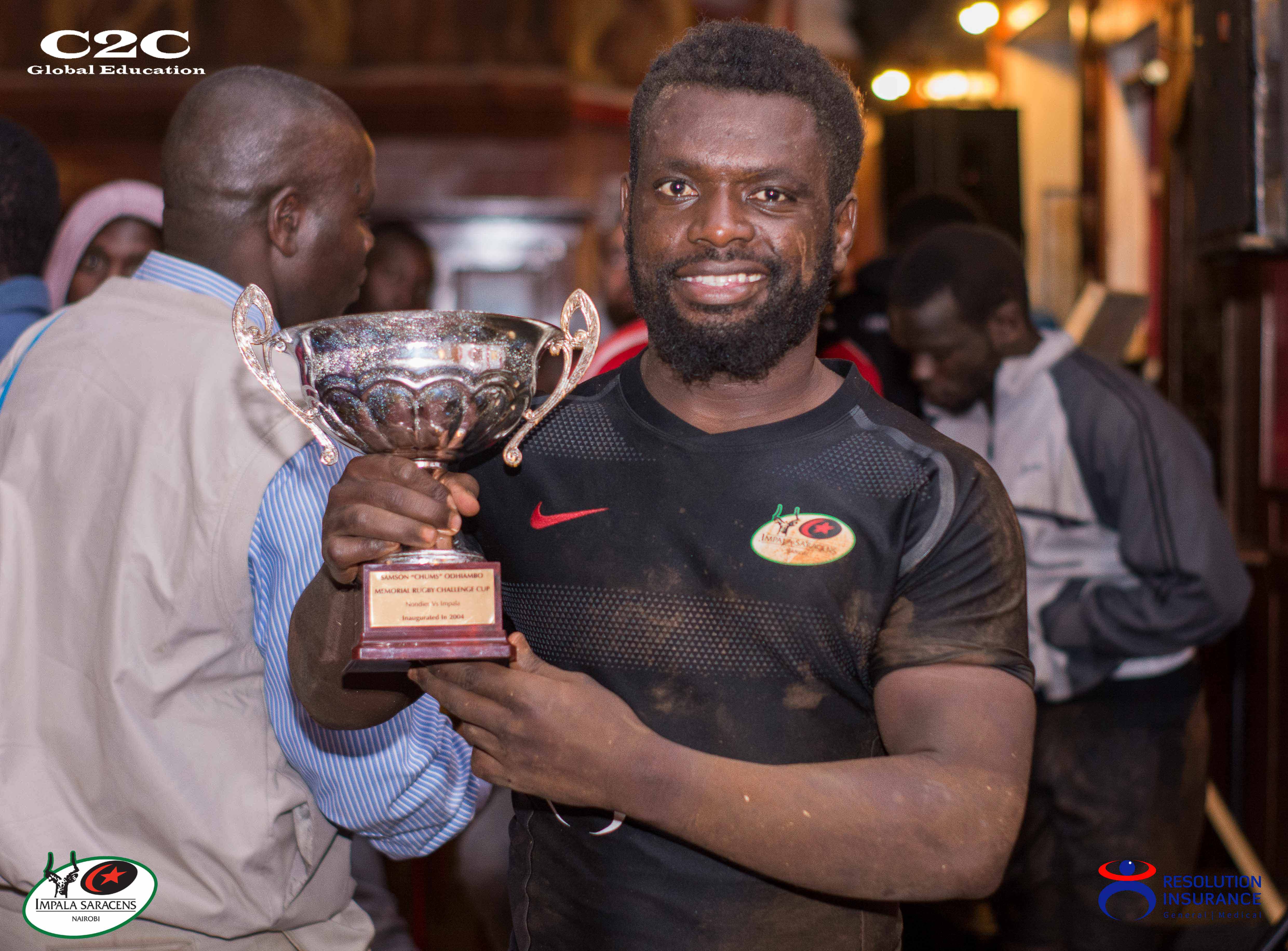 Resolution Impala Saracens team captain Samson Onsomu showing off the Chums Cup  in win against Nondies